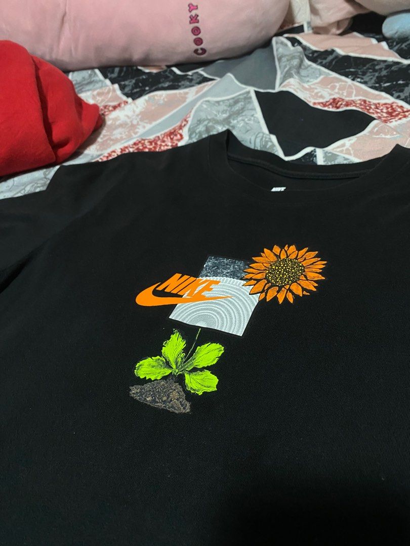 Nike Tee Black Sunflower Graphic Shirt (Category: Tshirts & Polo Shirts ) located in Manila. Submitted by drp4drp (Listing ID 1414065903, Image 3). Description: Dimes: 28 x 18.5 or 19 - Black Nike t-shirt - Size: S - Like new condition - Design: Sunflower graphic with Nike logo and 'Grow Your Sole' phrase - Features: Crew neck - Material: 100% cotton - Origin: Made in China.