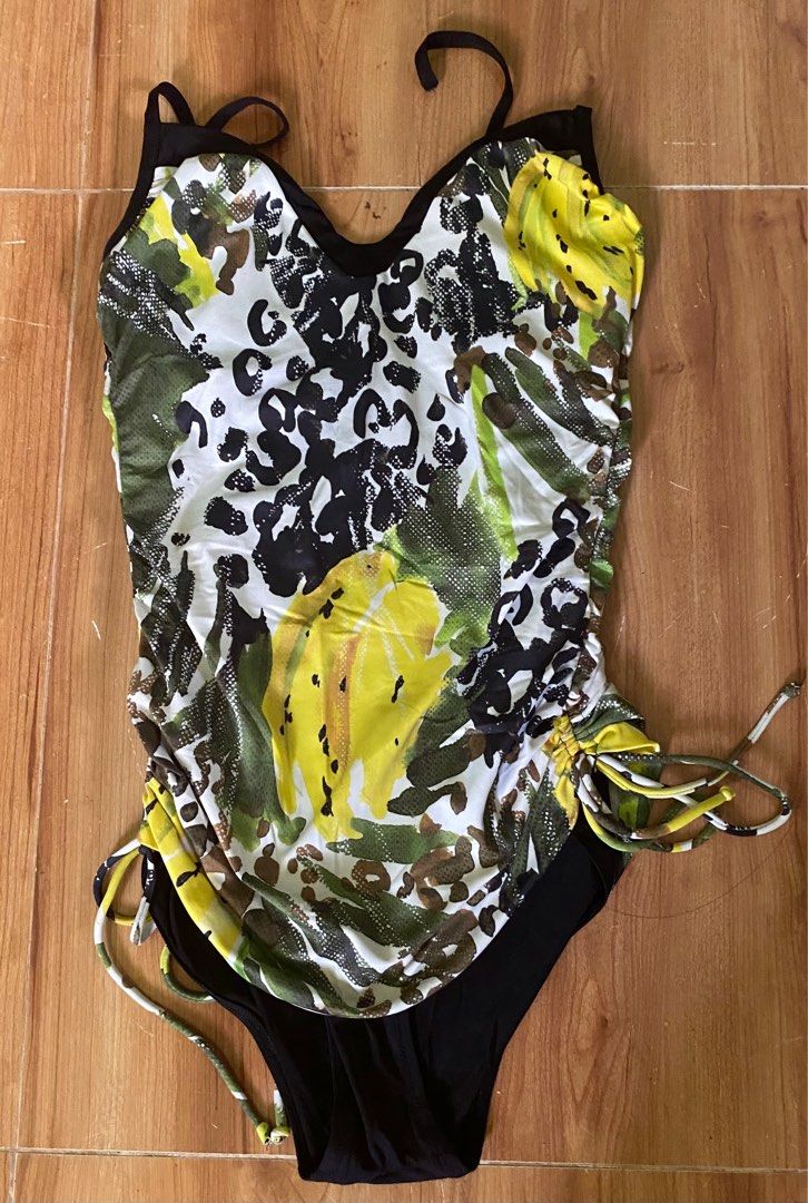 Printed One-Piece Swimsuit (Category: Bikinis & Swimsuits) located in Cagayan de Oro. Submitted by ecolive (Listing ID 1414068720, Image 1). Description: - Stylish one-piece swimsuit - Unique print: black, white, yellow, and green - Adjustable straps - Ruched detailing on sides - Black bottom - Perfect for beach or pool days.