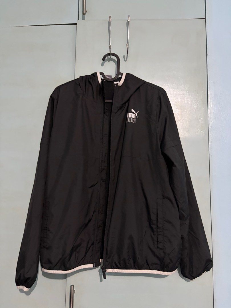 Puma Black Hooded Jacket Parka (Category: Coats, Jackets and Outerwear) located in Quezon City. Submitted by beeeeeeeeb (Listing ID 1414065428, Image 1). Description: - Black Puma jacket - Size: M - Features: Hood, white Puma logo (back and front), white trim - Closure: Full zipper - Interior: Mesh lining.