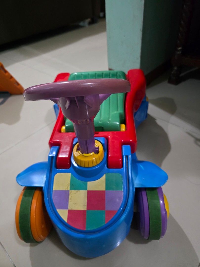 Push Walker / Ride-on car (Category: Infant Playtime) located in Manila. Submitted by iamsham (Listing ID 1414249499, Image 3). Description: Convertible push walker to ride-on car for babies. Pre-loved item with visible scratches and signs of normal use. Fully functional, but please manage expectations as this is not brand new..