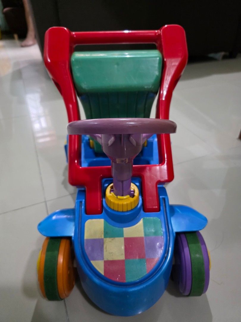 Push Walker / Ride-on car (Category: Infant Playtime) located in Manila. Submitted by iamsham (Listing ID 1414249499, Image 1). Description: Convertible push walker to ride-on car for babies. Pre-loved item with visible scratches and signs of normal use. Fully functional, but please manage expectations as this is not brand new..