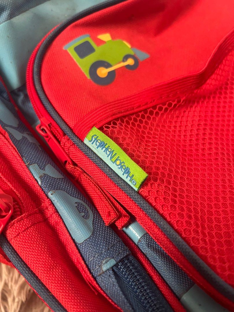 Rolling Backpack for Boys (Category: Babies & Kids Fashion) located in Muntinlupa City. Submitted by caistuff (Listing ID 1414129432, Image 2). Description: - Stephen Joseph rolling backpack with airplane design. - Large main compartment. - Front pocket with mesh pocket. - Side pockets. - Retractable handle and wheels for easy transport. - Red interior. - Blue, red, and green exterior accents..