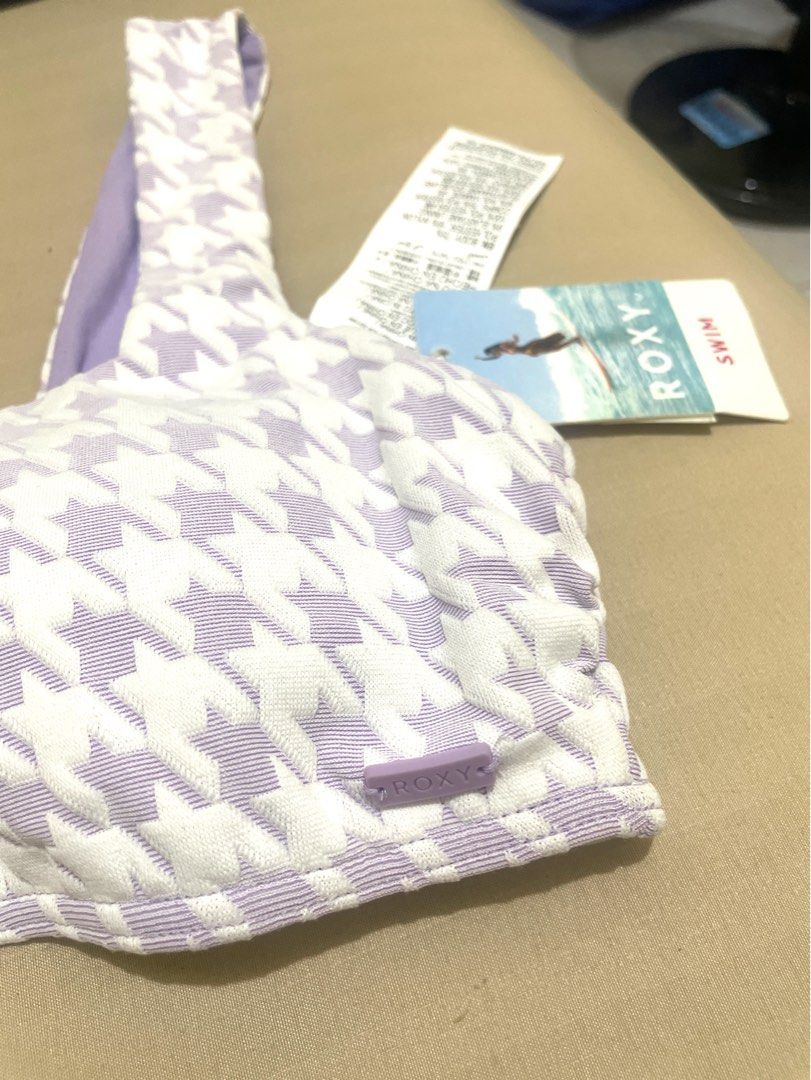 Roxy Houndstooth Bikini Top (Category: Bikinis & Swimsuits) located in Makati City. Submitted by thingsoncelovedph (Listing ID 1414206887, Image 2). Description: - Roxy houndstooth bikini top - Square neckline - Thick straps - Solid lavender lining - Includes original tags - Features Roxy logo.