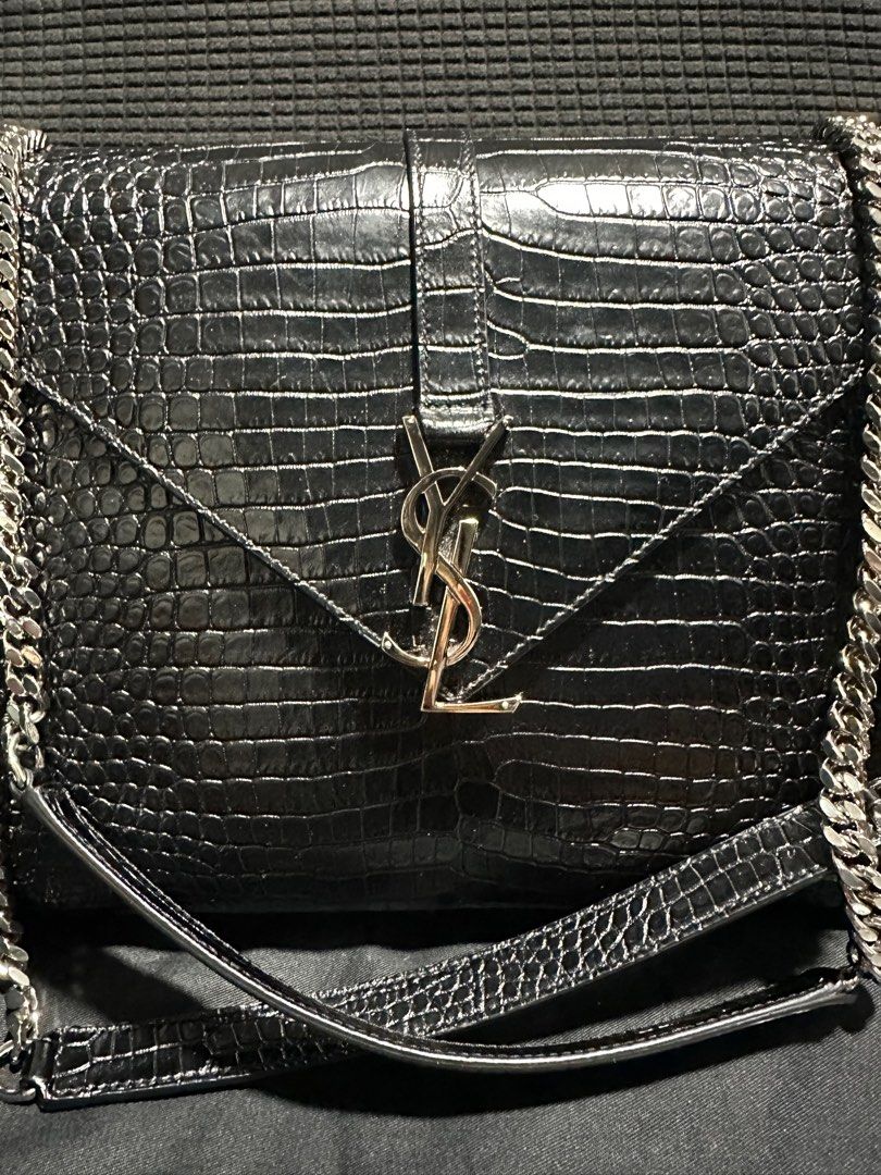 Saint Laurent crocodile embossed envelope bag (Category: Luxury Bags & Wallets) located in Atok. Submitted by fullroom.dgs (Listing ID 1414187898, Image 3). Description: Saint Laurent crocodile embossed envelope bag authentic rank a to sa.