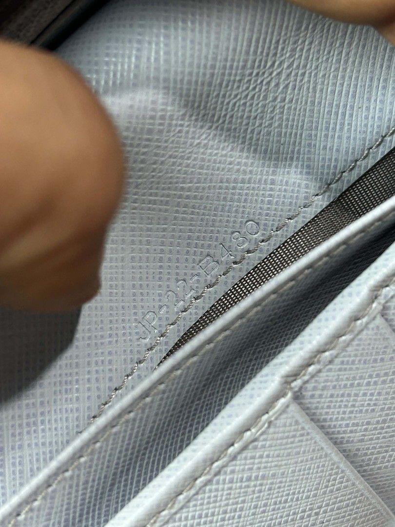 Salvatore Ferragamo Bow Wallet (Category: Luxury Bags & Wallets) located in Caloocan City. Submitted by snoworiontwinkle_08 (Listing ID 1414168361, Image 3). Description: - Authentic Salvatore Ferragamo wallet - Light blue color - Bow detail on the front - Multiple card slots - Coin compartment - Brand name visible inside - Serial number visible - Made in Italy.