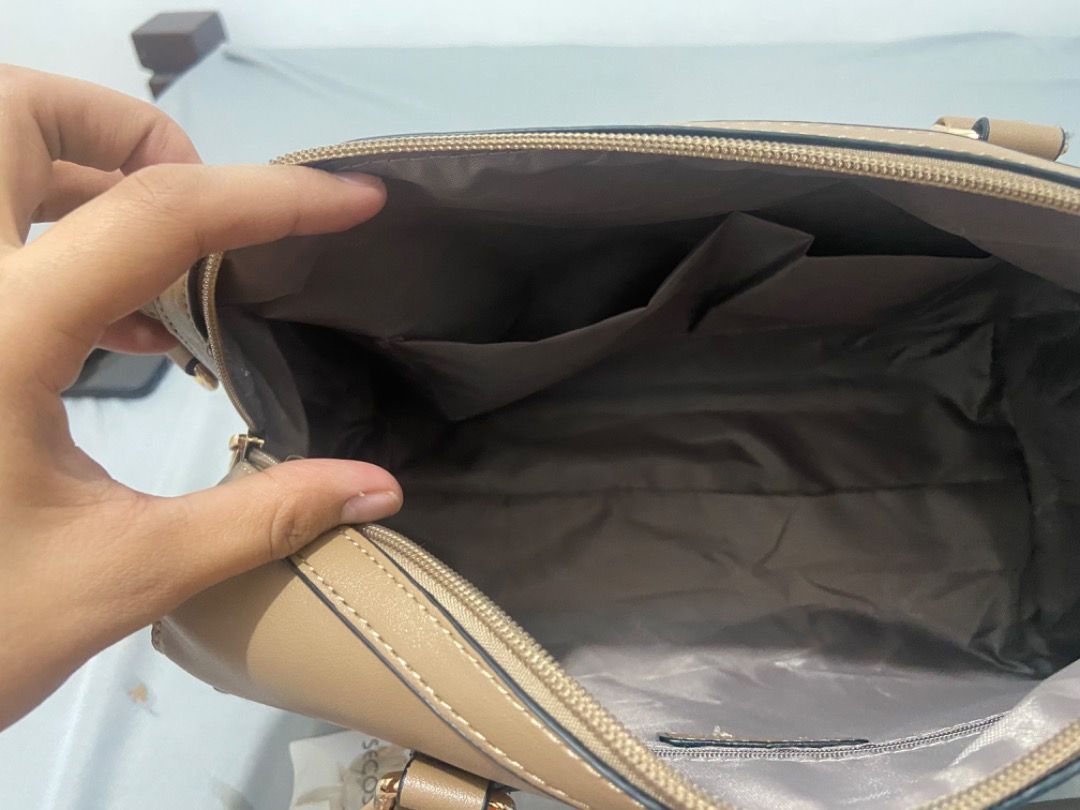 Secosana Handbag with Sling (Category: Shoulder Bags) located in Bacoor. Submitted by Suzette_0130 (Listing ID 1414228618, Image 3). Description: - Secosana handbag - Detachable sling - Top handle - Zipper closure - Interior pockets for organization - Neutral tan color - Never been used - Includes original tags ⚠️ Original price: ₱1,599.00 ⚠️.