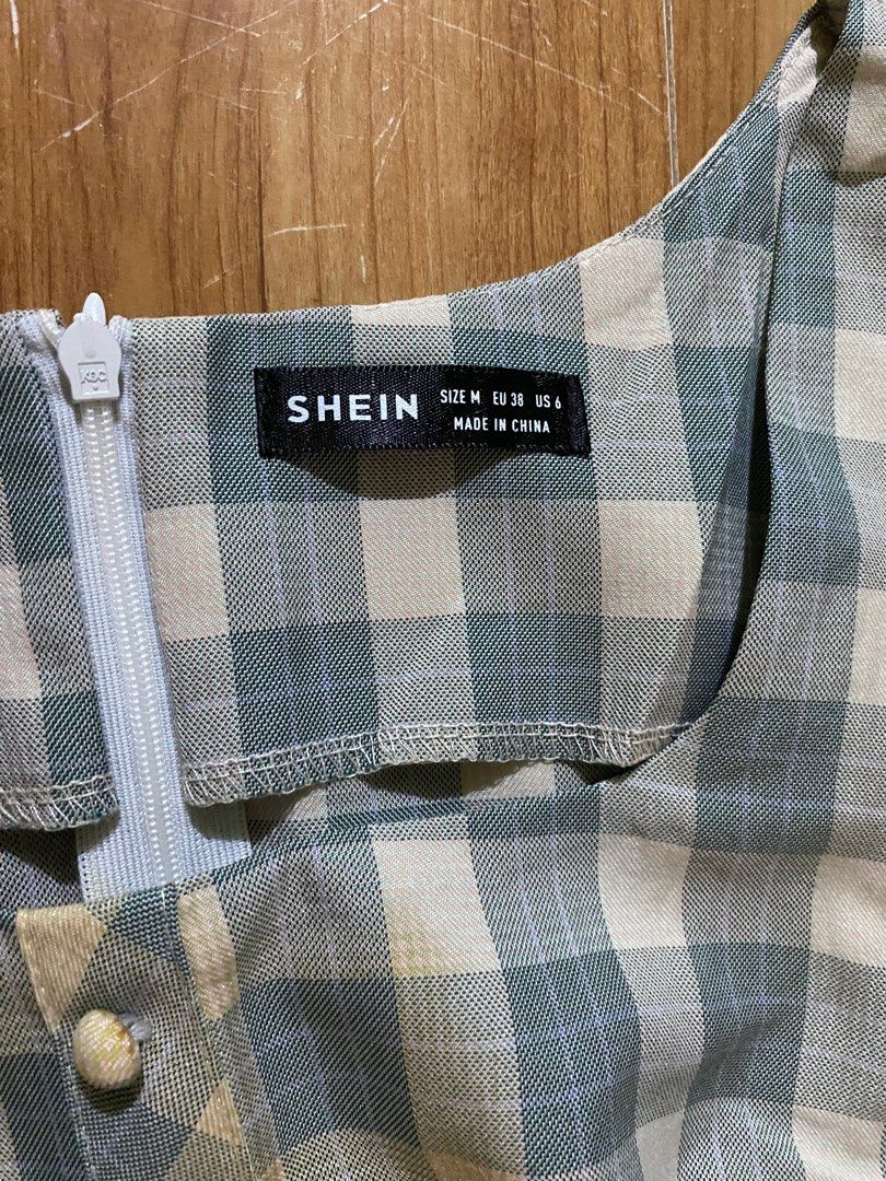 SHEIN Gingham Dress - Size M (Category: Dresses) located in Cagayan de Oro. Submitted by ecolive (Listing ID 1414065554, Image 2). Description: - Gingham midi dress - Color: Blue and white - Size: M - Features: Long sleeves, puff shoulder detail, button-down front.