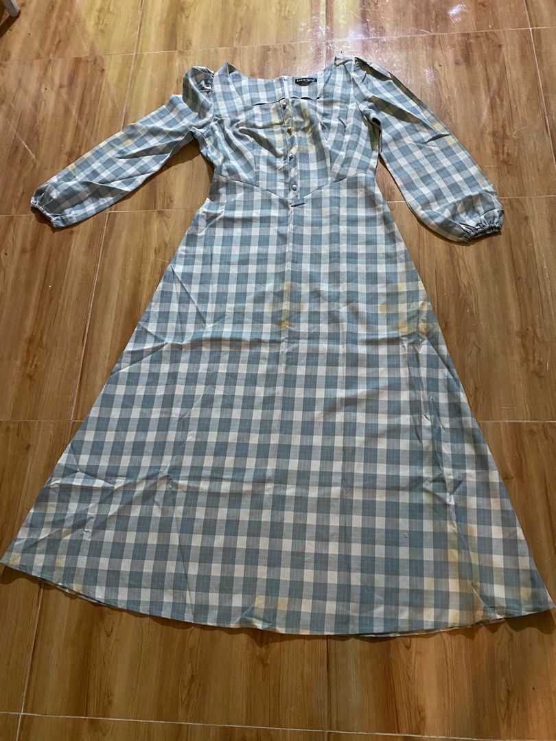 SHEIN Gingham Dress - Size M (Category: Dresses) located in Cagayan de Oro. Submitted by ecolive (Listing ID 1414065554, Image 1). Description: - Gingham midi dress - Color: Blue and white - Size: M - Features: Long sleeves, puff shoulder detail, button-down front.