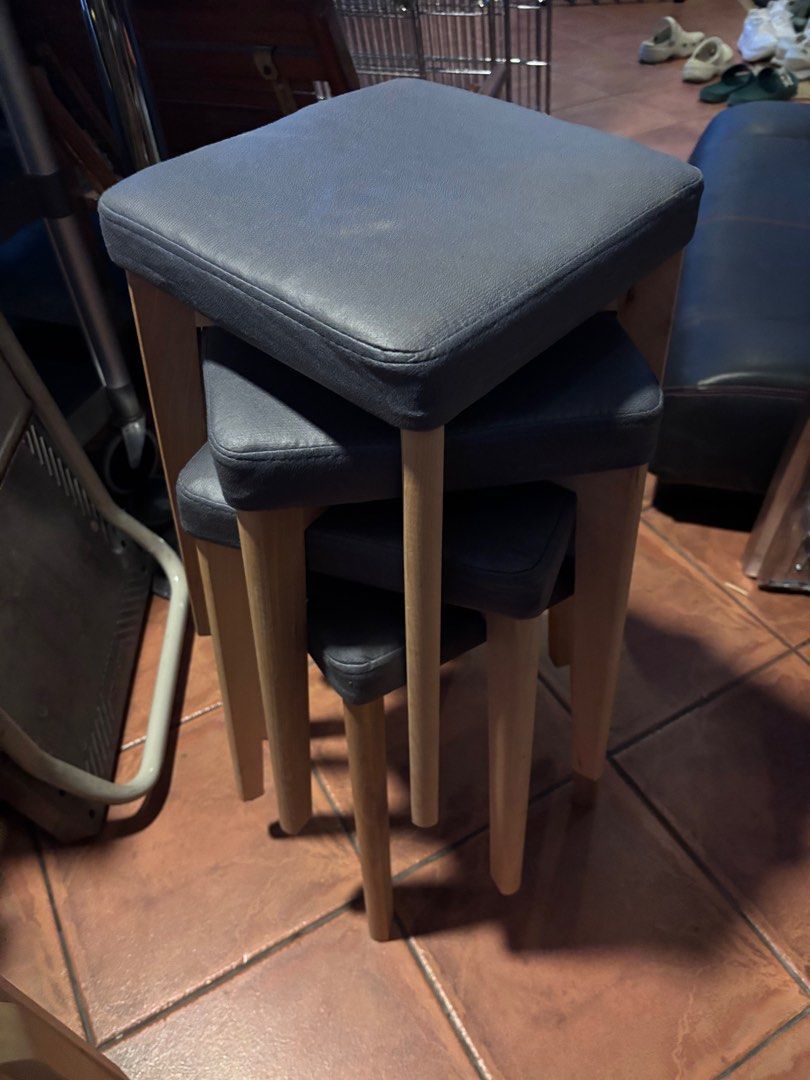Stackable Stool Set - Grey (Category: Chairs) located in Singapore. Submitted by thrina (Listing ID 1414174786, Image 1). Description: - Set of stackable stools - Features grey padded seat - Light wood legs - $8 per piece I have 4 of this - Ideal for small spaces - Perfect for living room or bedroom.