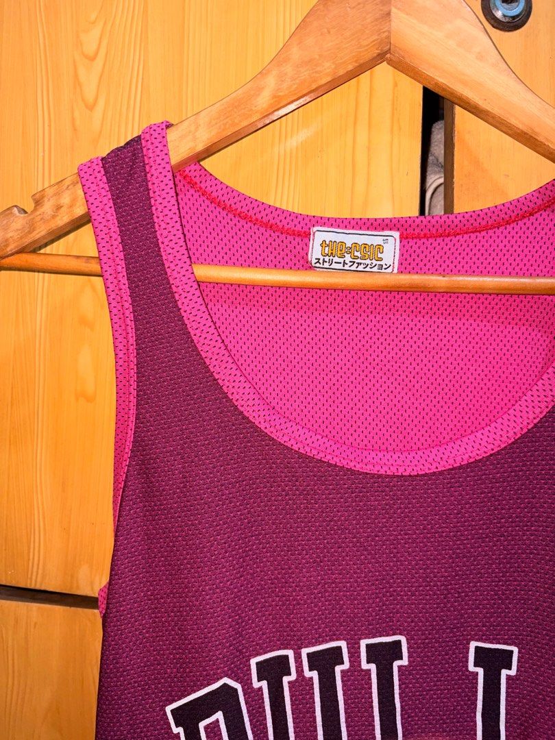 The Chic Chicago Bulls 23 Jersey (Category: Activewear) located in Manila. Submitted by ciiii1 (Listing ID 1414216209, Image 2). Description: - Reversible Chicago Bulls jersey - Features the iconic Bulls logo and #23 - Pink mesh inner layer - Maroon outer layer - Sleeveless design - Made of breathable material.