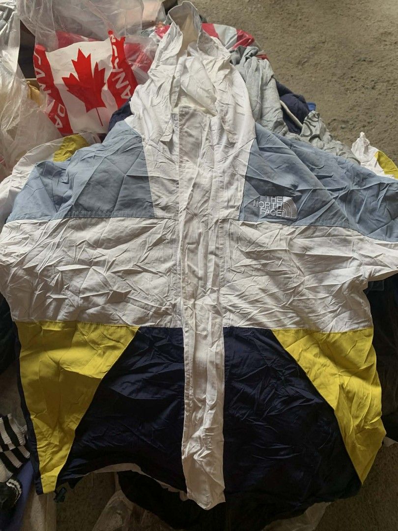 The North Face Colorblock Windbreaker (Category: Coats, Jackets and Outerwear) located in Talavera. Submitted by exchangethrift (Listing ID 1414213903, Image 1). Description: - The North Face colorblock windbreaker - Color scheme: White, blue, yellow, and navy panels - Full zip closure - Hooded - The North Face logo on chest - Lightweight material - Relaxed fit - Long sleeves - Negotiable .