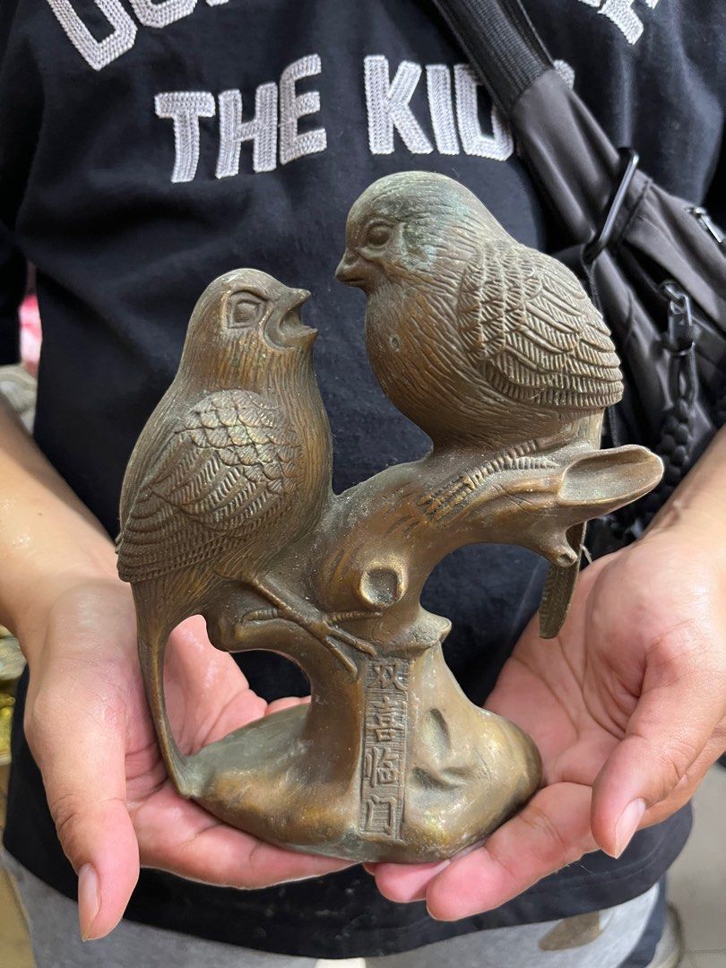 Vintage Bronze Bird Figurine (Category: Vintage Collectibles) located in Manila. Submitted by vintage_styles_co (Listing ID 1414241869, Image 2). Description: Vintage bronze figurine depicting two birds perched on a branch. It features Chinese characters at the base. A unique decorative piece for your home or a great addition to a collection..