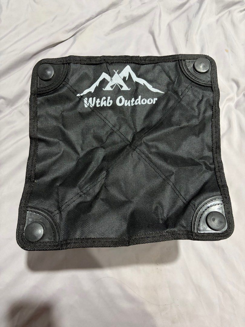 Wthb Outdoor Folding Camping Stool (Category: Chairs) located in Bulacan. Submitted by gamegirl97 (Listing ID 1414086867, Image 1). Description: - Black Wthb Outdoor folding camping stool - Black fabric seat with Wthb Outdoor logo - Black metal frame - Folds for easy storage and transport - Plastic feet for stability - Compact and lightweight - Ideal for outdoor activities.