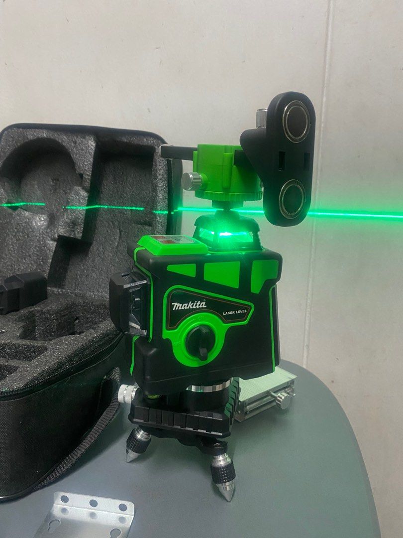 12 Line Clear Precision Laser Level High-Quality Laser Meter with Advanced Leveling Laser Technology (Category: Construction Tools & Equipment) located in Manila. Submitted by relovedmnl (Listing ID 1414262779, Image 2). Description: - Makita laser level with carrying case, green laser glasses, and accessories. - Black and green color. - In good working condition. - Includes tripod mount and other attachments. - Carrying case included for easy st