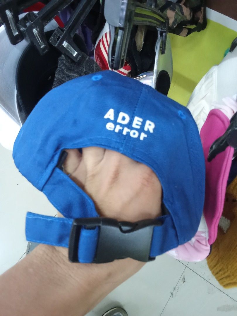 ADER Error French Fries Cap (Category: Caps & Hats) located in Manila. Submitted by nomsojyara49223 (Listing ID 1414295695, Image 2). Description: - Blue cap with a yellow brim - Features a French fries graphic - "ADER error" brand name embroidered on the back - Adjustable strap with black buckle.
