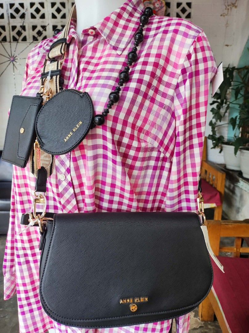 Anne Klein Black Handbag Set (Category: Luxury Bags & Wallets) located in Malungon. Submitted by maypen2745648 (Listing ID 1414291750, Image 2). Description: - Anne Klein handbag set - Includes: black crossbody bag, small wallet, and round coin purse - Gold-tone logo and hardware - Detachable strap and beaded chain - New with tags attached.