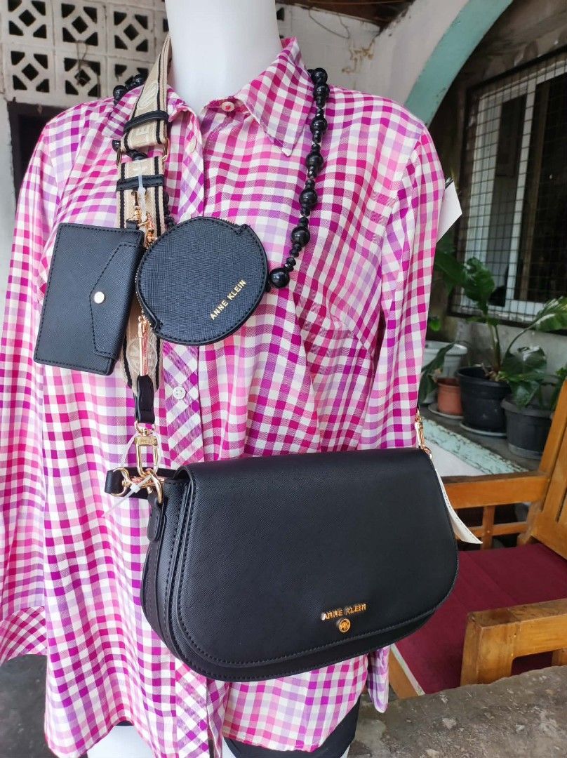 Anne Klein Black Handbag Set (Category: Luxury Bags & Wallets) located in Malungon. Submitted by maypen2745648 (Listing ID 1414291750, Image 1). Description: - Anne Klein handbag set - Includes: black crossbody bag, small wallet, and round coin purse - Gold-tone logo and hardware - Detachable strap and beaded chain - New with tags attached.