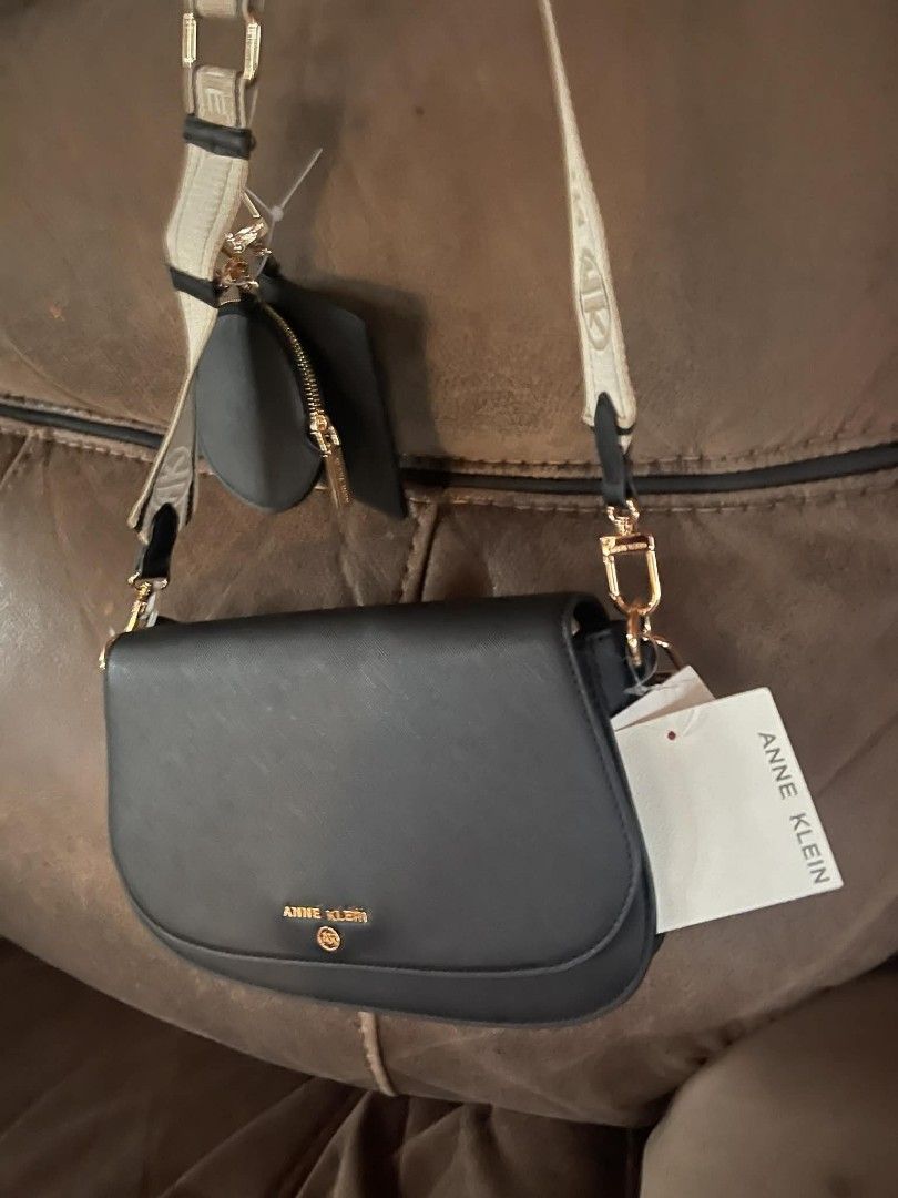 Anne Klein Black Handbag Set (Category: Luxury Bags & Wallets) located in Malungon. Submitted by maypen2745648 (Listing ID 1414291750, Image 3). Description: - Anne Klein handbag set - Includes: black crossbody bag, small wallet, and round coin purse - Gold-tone logo and hardware - Detachable strap and beaded chain - New with tags attached.