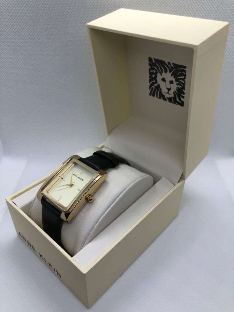 Anne Klein Gold Rectangular Watch (ARRIVING ON OR BEFORE JANUARY 21 FROM US) (Category: Women's Watches) located in Taguig. Submitted by nday26 (Listing ID 1414376606, Image 2). Description: - Anne Klein watch - Gold rectangular case - Cream-colored dial - Gold-tone hands and markers - Black leather strap - Comes with original box - Authentic Anne Klein Location: Shore 3 Tower 2, Pasay City.
