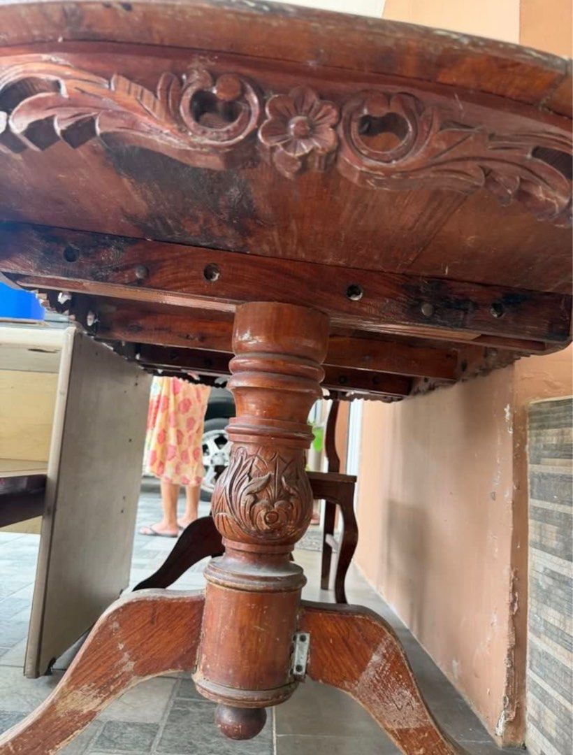 Antique Wooden Dining Table with Chairs (Category: Tables & Sets) located in Rizal. Submitted by caintarizal2024 (Listing ID 1414263769, Image 3). Description: - Antique oval dining table with issue - Features detailed carvings - Narra wood - Sturdy base with wheels for easy movement - Includes separate glass top - With 5 chairs (narra) Including office table table AS IS WHERE IS Last Price Posted .