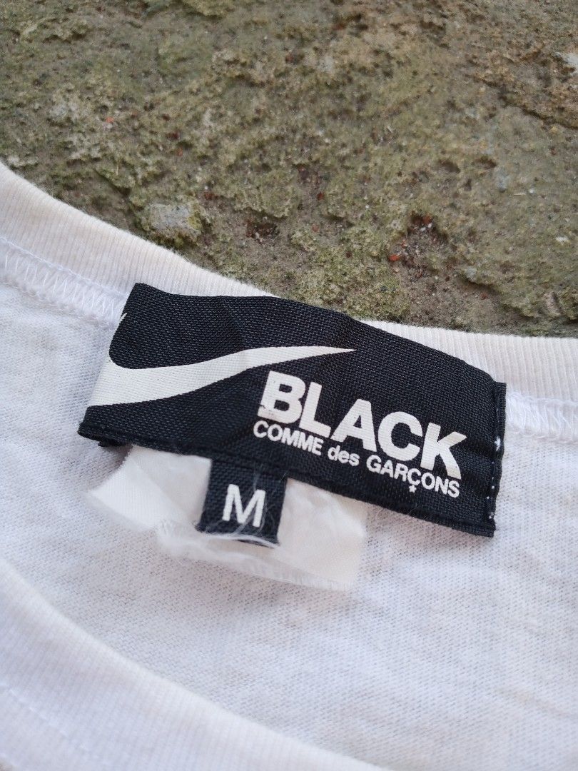 Black Comme des Garcons x Nike T-shirt (Category: Tshirts & Polo Shirts ) located in Caloocan City. Submitted by giriyeys793 (Listing ID 1414331345, Image 3). Description: - Nike x Comme des Garcons collaboration T-shirt - Features graphic print with "1973 NIKE-CDG STORM THE BUTTE" design - Size: M -Dimes 20W/26L - Made in Japan - Material: 100% cotton - Care: Hand wash recommended.