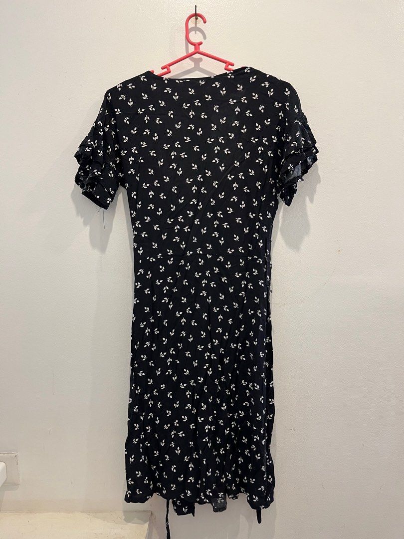 Black Floral Dress (Category: Dresses) located in Antipolo. Submitted by _gellavctrn (Listing ID 1414322747, Image 2). Description: - Black floral midi dress - V-neckline - Short sleeves with ruffle details - Button-down front - Slightly flared hem - Lightweight fabric - Missing 1 button and detachable ribbon.