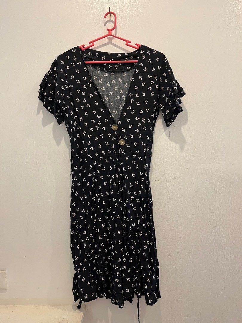 Black Floral Dress (Category: Dresses) located in Antipolo. Submitted by _gellavctrn (Listing ID 1414322747, Image 1). Description: - Black floral midi dress - V-neckline - Short sleeves with ruffle details - Button-down front - Slightly flared hem - Lightweight fabric - Missing 1 button and detachable ribbon.