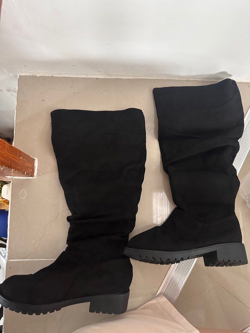 Black Knee High Boots Size 37 (Category: Boots) located in Tanza. Submitted by euniceericka (Listing ID 1414280128, Image 2). Description: - Black knee-high boots - Size 37 (fits size 6) - Slightly slouchy design - Suede-like material - Textured sole - Suitable for casual wear - Never been used - With free white socks RFS: Wrong size .