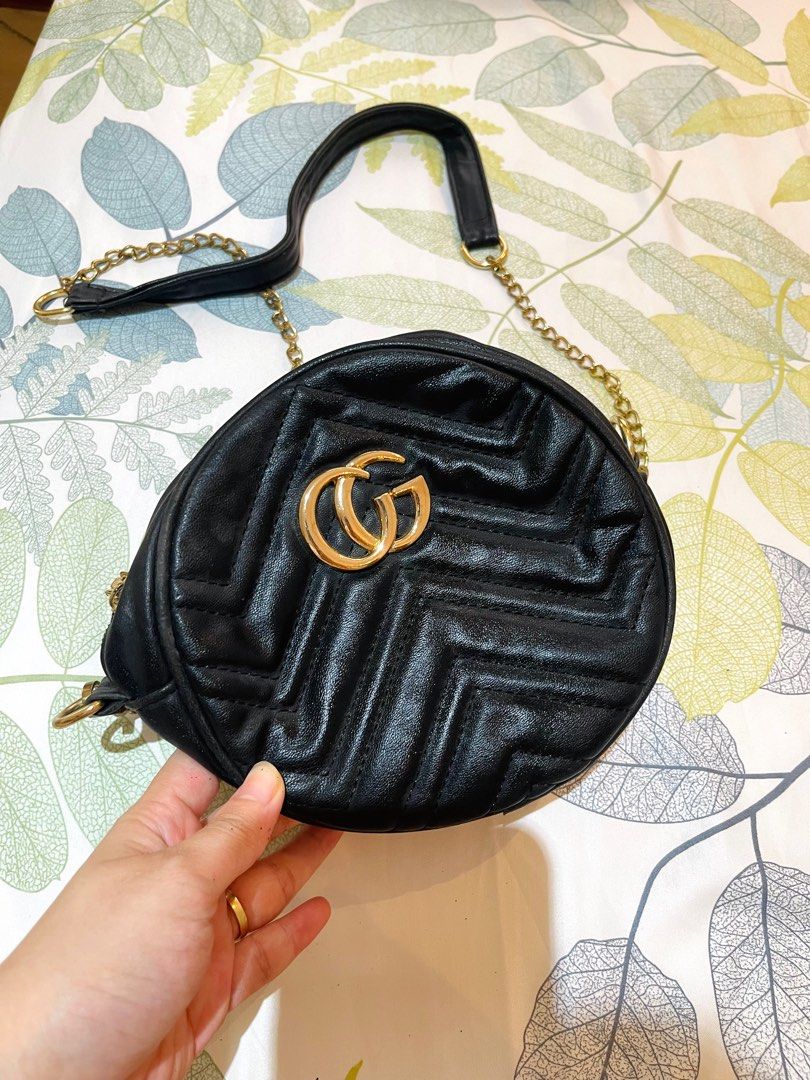 Black Round Shoulder Bag with Gold Chain (Category: Shoulder Bags) located in Cainta. Submitted by coatclosetph (Listing ID 1414333240, Image 1). Description: - Black round shoulder bag - Gold chain strap - Gold double G logo - Quilted design - Top handle - Leather or leather-like material - mejo may rust na.