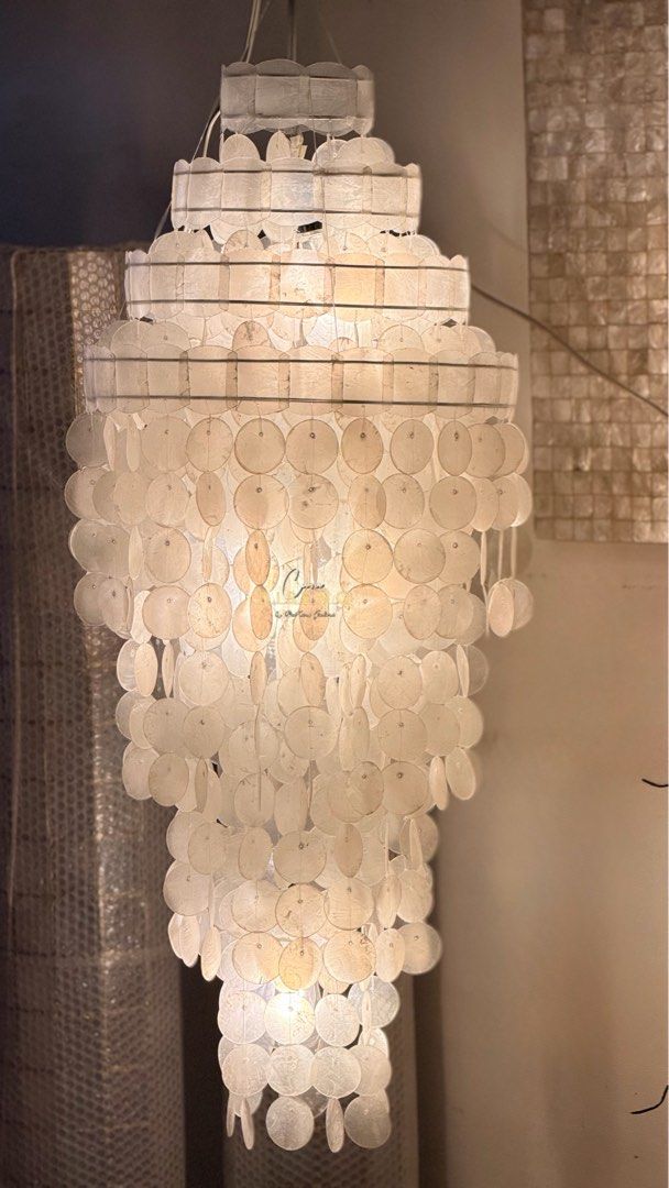 Capiz Shell Chandelier (Category: Lighting) located in Caloocan City. Submitted by casadisenyo (Listing ID 1414351181, Image 2). Description: Size 16” d x 40” H 1pc available READY TO SHIP - Capiz shell chandelier - Tiered design - Creates soft, diffused light - Cascading shape - Ideal for living rooms, dining areas, and entryways We also customize other capiz chandeliers Message us for quotations and inquiries! .