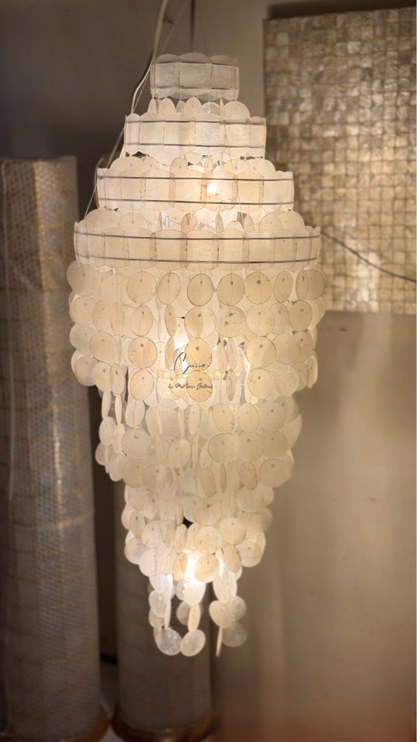 Capiz Shell Chandelier (Category: Lighting) located in Caloocan City. Submitted by casadisenyo (Listing ID 1414351181, Image 1). Description: Size 16” d x 40” H 1pc available READY TO SHIP - Capiz shell chandelier - Tiered design - Creates soft, diffused light - Cascading shape - Ideal for living rooms, dining areas, and entryways We also customize other capiz chandeliers Message us for quotations and inquiries! .