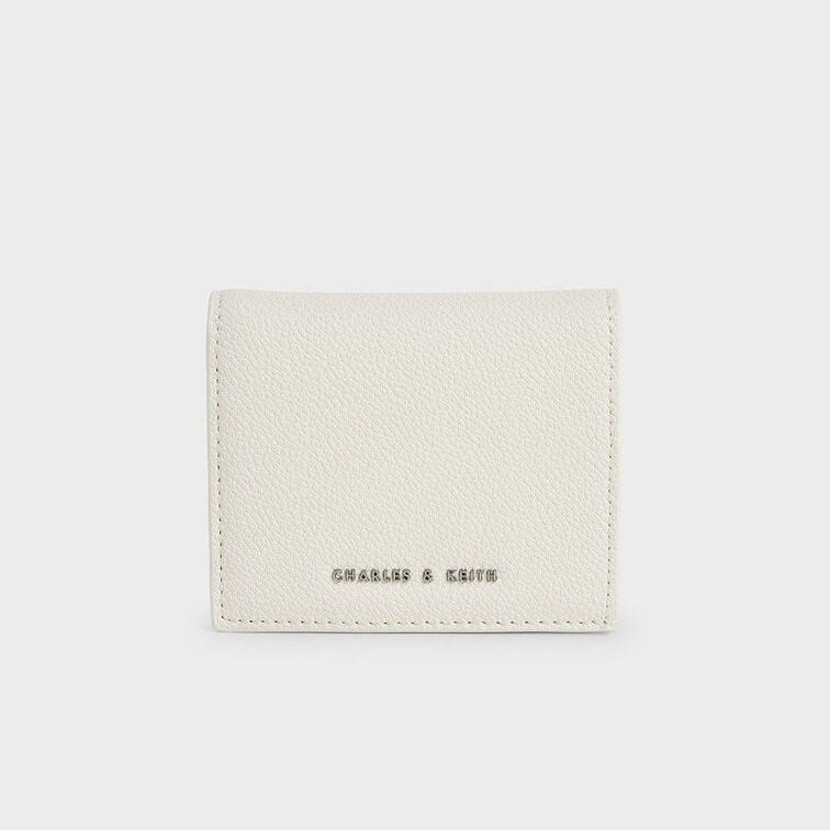 Charles & Keith Small Wallet Cream (Category: Wallets & Card holders) located in Manila. Submitted by decluttertheglitter (Listing ID 1414413879, Image 1). Description: Brand: Charles & Keith Condition: Like new Original Price: ₱2,500 Selling Price: ₱1,000 + 2 free unbranded wallets Flaws/Notes: 100% authentic, money-back guarantee.