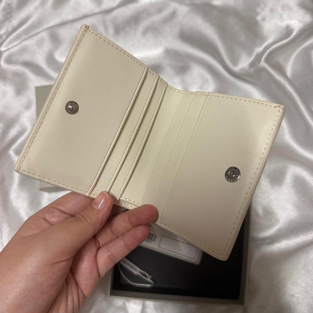Charles & Keith Small Wallet Cream (Category: Wallets & Card holders) located in Manila. Submitted by decluttertheglitter (Listing ID 1414413879, Image 3). Description: Brand: Charles & Keith Condition: Like new Original Price: ₱2,500 Selling Price: ₱1,000 + 2 free unbranded wallets Flaws/Notes: 100% authentic, money-back guarantee.