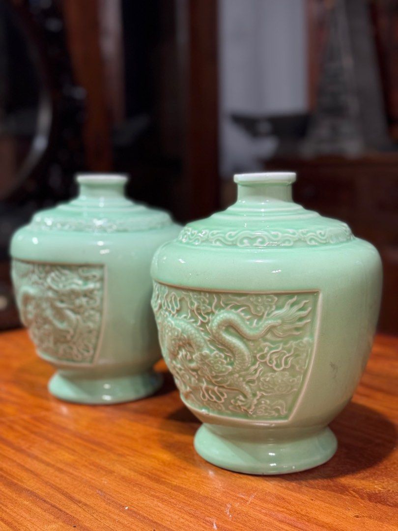 Chinese celadon-glazed porcelain jars (Category: Vases & Decorative Bowls) located in Manila. Submitted by sinaunang_gamit (Listing ID 1414340185, Image 3). Description: Chinese celadon-glazed porcelain jars They feature detailed, crisply carved and molded five-clawed dragons in relief on the exterior. The distinctive light blue-green hue is characteristic of traditional Chinese celadon glaze. The shape is a squat jar form with high shoulders and