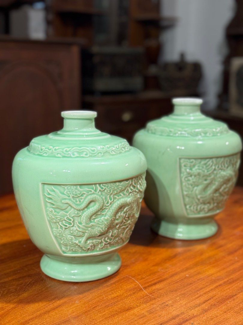 Chinese celadon-glazed porcelain jars (Category: Vases & Decorative Bowls) located in Manila. Submitted by sinaunang_gamit (Listing ID 1414340185, Image 2). Description: Chinese celadon-glazed porcelain jars They feature detailed, crisply carved and molded five-clawed dragons in relief on the exterior. The distinctive light blue-green hue is characteristic of traditional Chinese celadon glaze. The shape is a squat jar form with high shoulders and