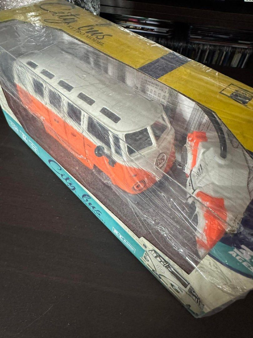 City Bus Retro Model Toy (Category: Vehicle & Diecast Models) located in Quezon City. Submitted by things.matter (Listing ID 1414272269, Image 3). Description: - City Bus Retro Model - Scale: 1:30 - Color: Orange and White - Features: Remote Control - Condition: Brand New, Sealed.