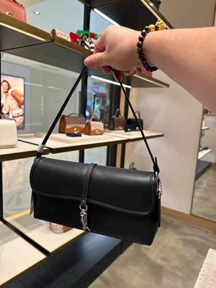 Coach Madison Shoulder Bag (Category: Luxury Bags & Wallets) located in Manila. Submitted by clairetot (Listing ID 1414337665, Image 3). Description: - Coach Madison shoulder bag - Available in multiple colors - Features a flap closure with metal clasp - Includes a shoulder strap - Rectangular shape - Made of leather - Comes with Coach tag - Includes Coach paper bag.