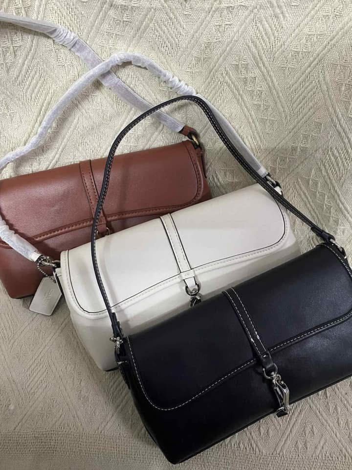 Coach Madison Shoulder Bag (Category: Luxury Bags & Wallets) located in Manila. Submitted by clairetot (Listing ID 1414337665, Image 1). Description: - Coach Madison shoulder bag - Available in multiple colors - Features a flap closure with metal clasp - Includes a shoulder strap - Rectangular shape - Made of leather - Comes with Coach tag - Includes Coach paper bag.