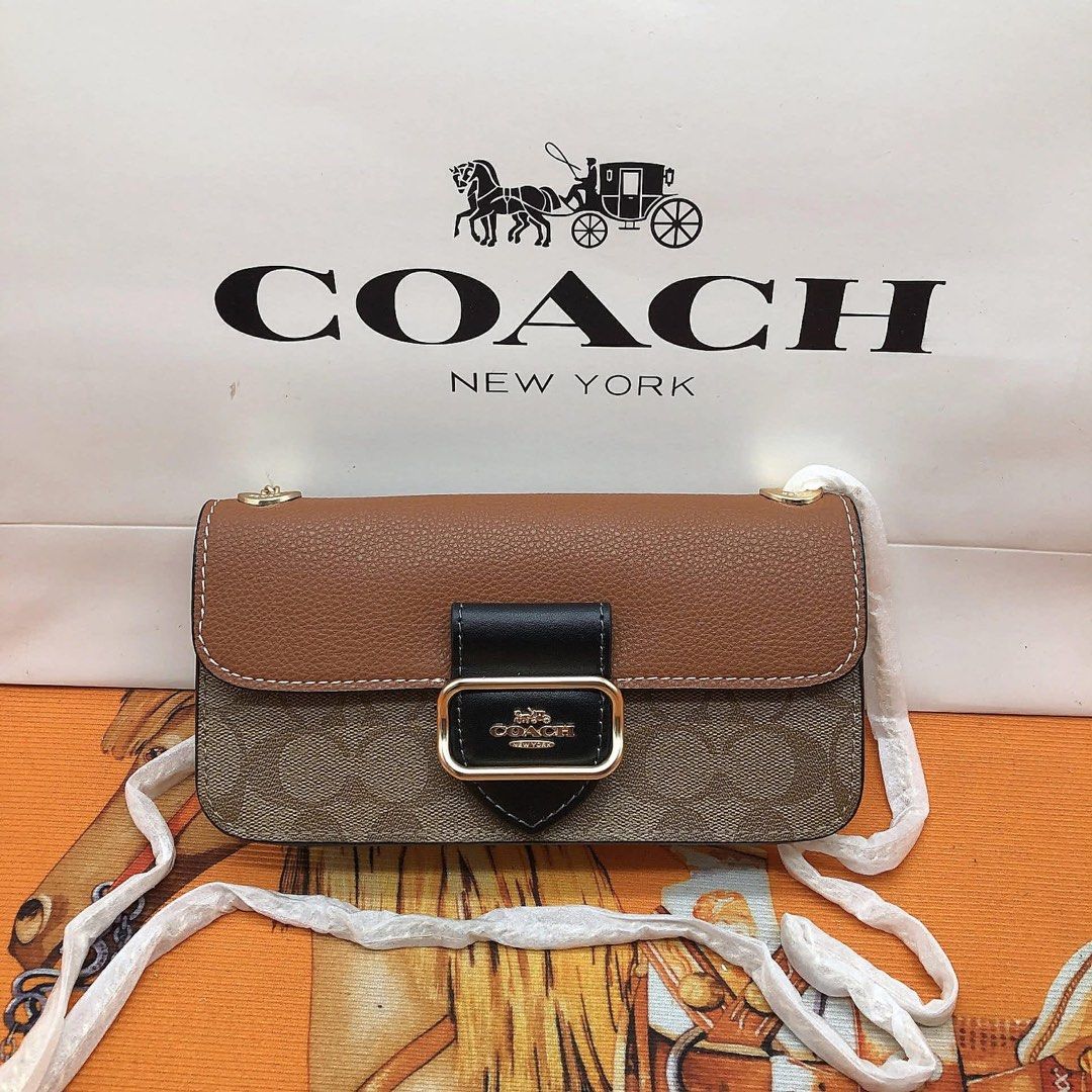 Coach Mini Shoulder Bag (Category: Luxury Bags & Wallets) located in Manila. Submitted by clairetot (Listing ID 1414332720, Image 1). Description: - Coach mini shoulder bag - Signature logo pattern - Chain strap - Flap closure with gold-tone buckle - Interior brand tag - Available colors: Brown, Pink, Navy - Includes Coach paper bag.
