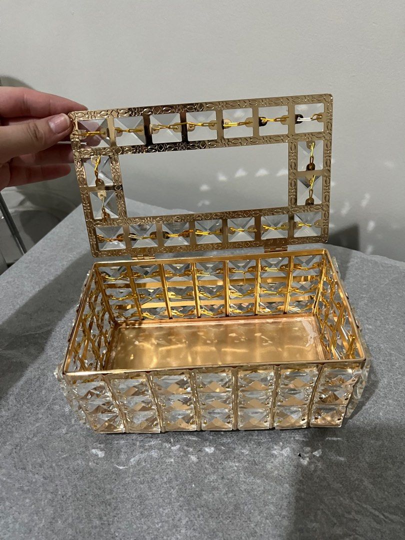 Crystal Gold Tissue Box (Category: Storage Boxes & Baskets) located in Quezon City. Submitted by styleandcomfort (Listing ID 1414377623, Image 2). Description: One side a bit tilted ( i got it like that i guess due to shipping) Recently bought Message me for inquiries.