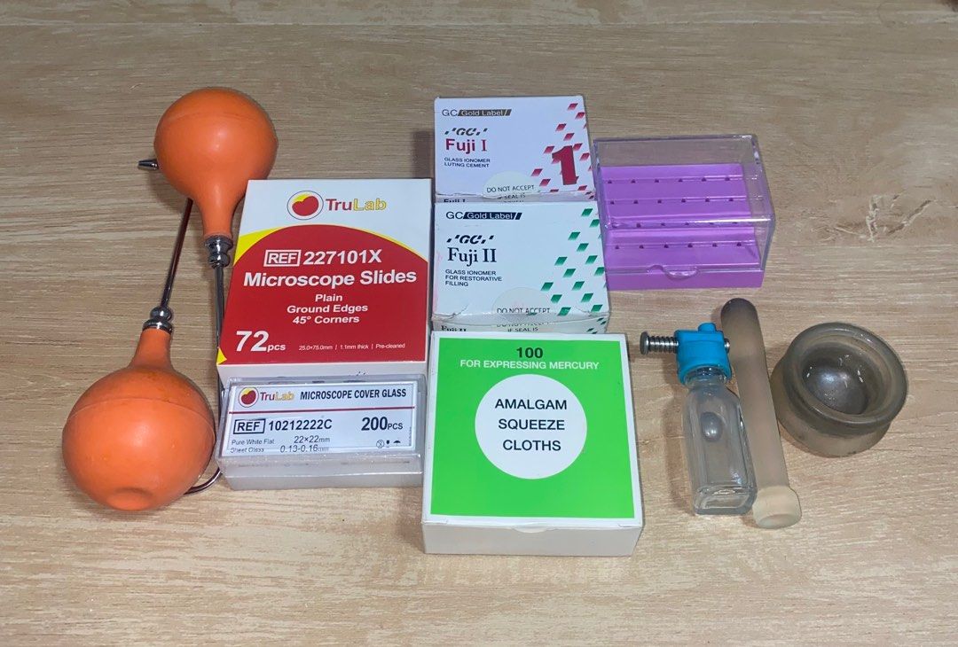 Dental Materials (Category: Medical Supplies & Tools) located in Mandaluyong City. Submitted by declutts (Listing ID 1414395224, Image 2). Description: nissin compatible jaw (no typodonts) amalgam squeeze cloth mercury dispenser w/ mercury mortar and pestle gic type i gic type ii bur organizer microscope slides microscope cover glass air and water syringe.