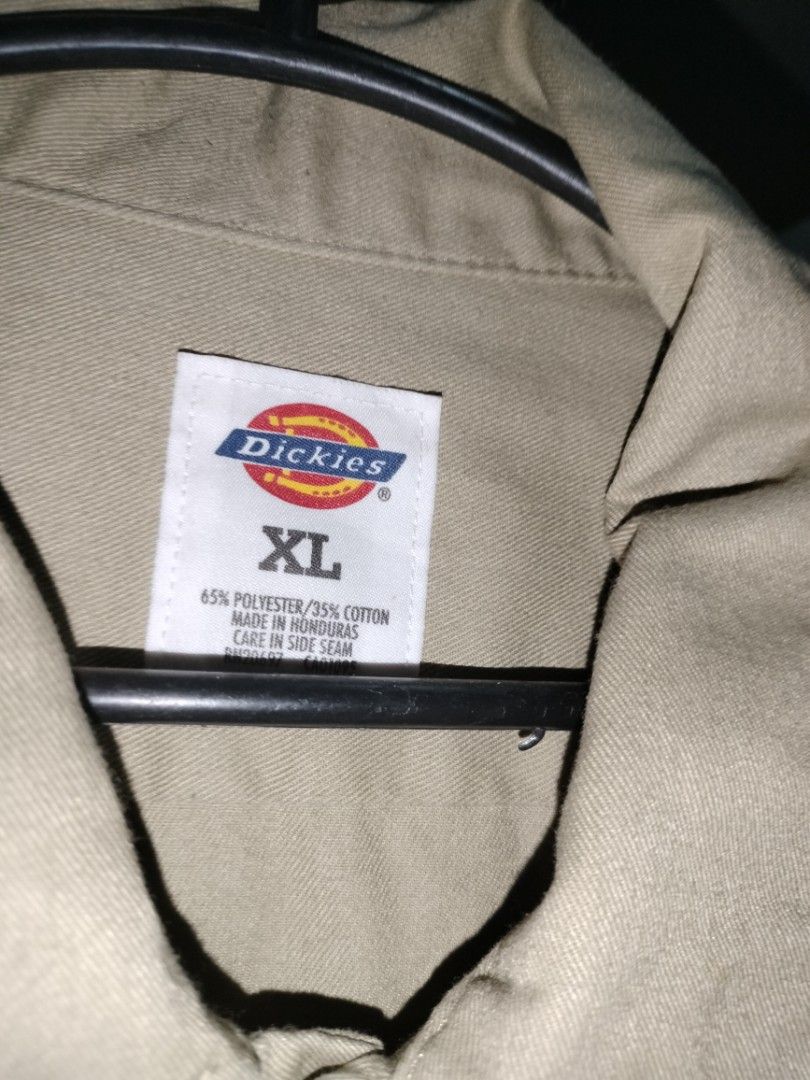 Dickies XL Long Sleeve Shirt (Category: Tshirts & Polo Shirts ) located in Manila. Submitted by kenjiryu (Listing ID 1414378541, Image 1). Description: - Dickies long sleeve shirt - Size: XL - Color: Light Tan - Features: Button-down front, two chest pockets, buttoned cuffs - Material: 65% polyester, 35% cotton - Made in Honduras nasa pic yung issue ng item.