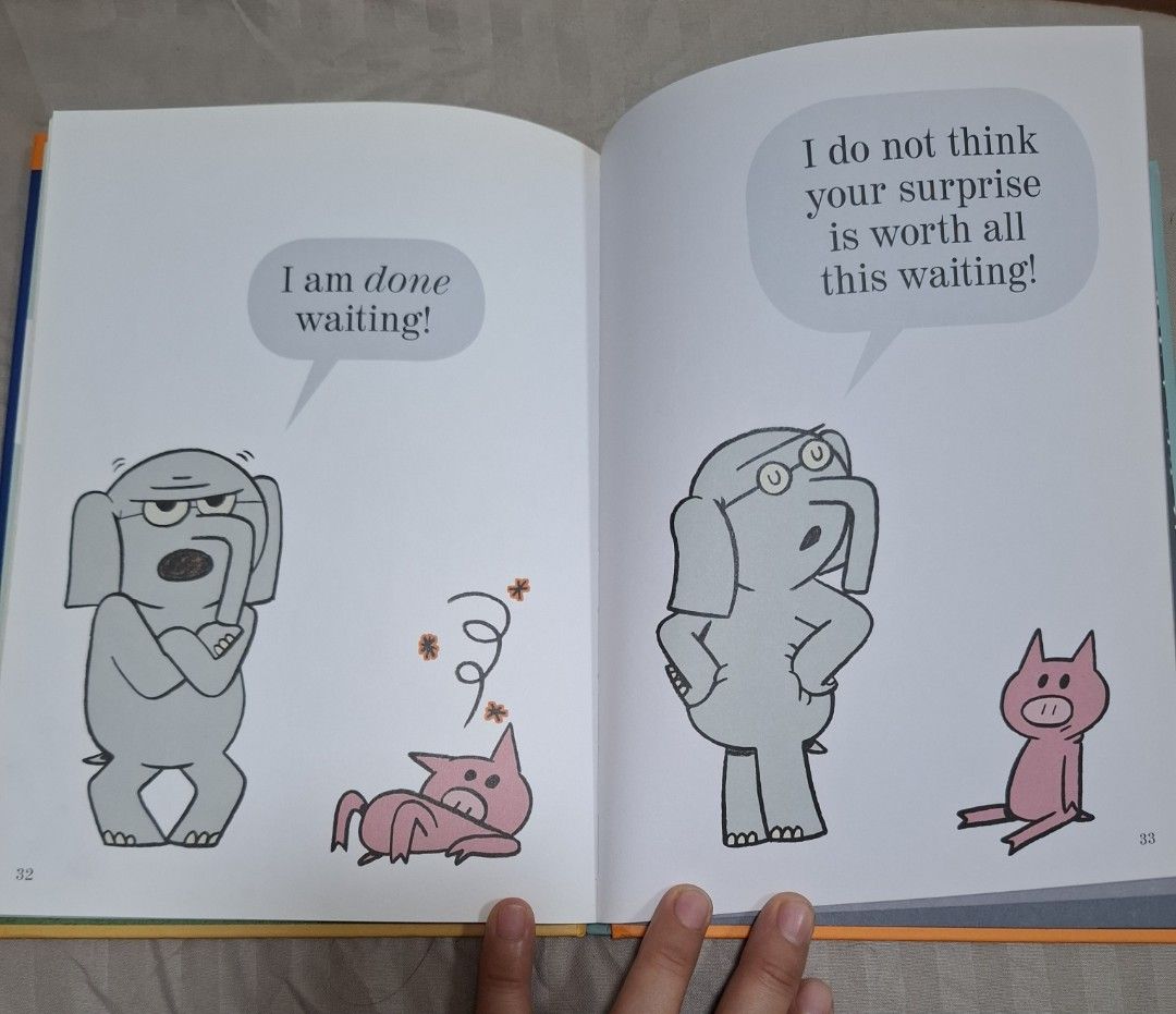 Elephant & Piggie Book: Waiting Is Not Easy! (Category: Children's Books) located in Makati City. Submitted by chyna527 (Listing ID 1414375096, Image 3). Description: Elephant & Piggie book titled "Waiting Is Not Easy!" by Mo Willems. The book features colorful illustrations and is part of the Elephant & Piggie series. The book has a blue cover with orange accents..