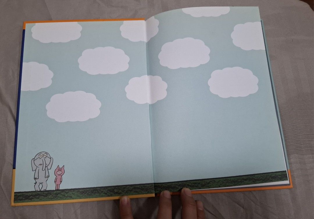 Elephant & Piggie Book: Waiting Is Not Easy! (Category: Children's Books) located in Makati City. Submitted by chyna527 (Listing ID 1414375096, Image 2). Description: Elephant & Piggie book titled "Waiting Is Not Easy!" by Mo Willems. The book features colorful illustrations and is part of the Elephant & Piggie series. The book has a blue cover with orange accents..