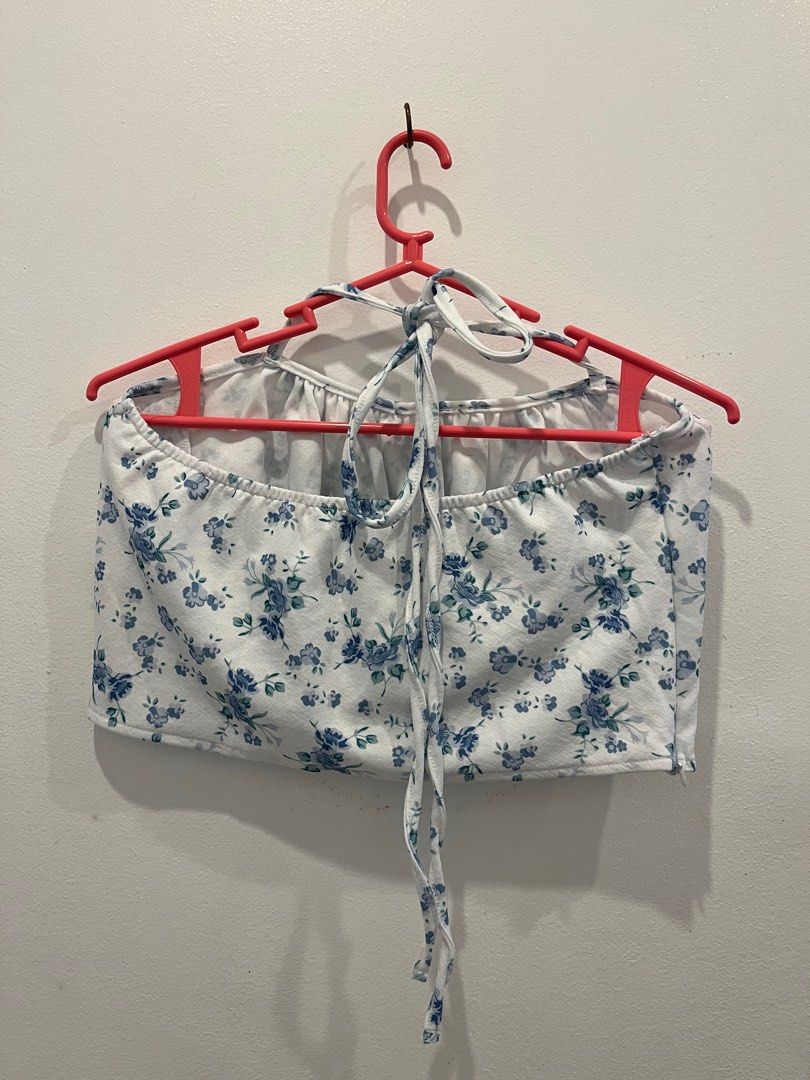 Floral Crop Top and Skirt Set (Category: Sets or Coordinates) located in Antipolo. Submitted by _gellavctrn (Listing ID 1414322113, Image 2). Description: - White fabric with blue floral prints - Halter-neck crop top with gathered bust and tie closure - Mini skirt with elastic waistband - Matching fabric and pattern for both pieces.