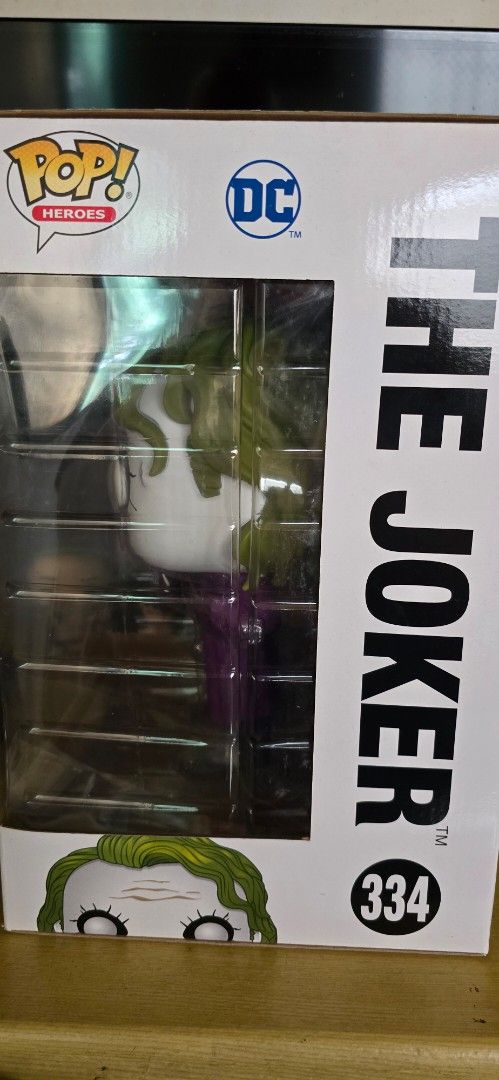 Funko Pop! Heroes The Joker #334 (Category: Designer & Blind Box Toys) located in Manila. Submitted by gilbert.p (Listing ID 1414439074, Image 3). Description: - Funko Pop! figure of The Joker from The Dark Knight Trilogy. - Vinyl figure. - Heroes series #334. - Features other characters like Batman and Two-Face on the box. - Comes in original packaging..
