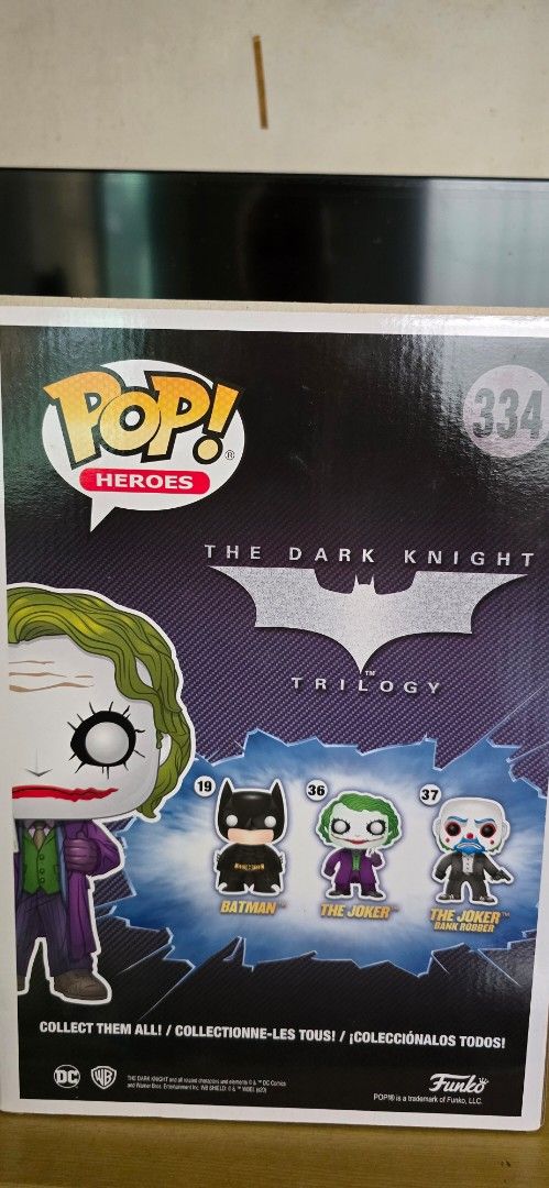 Funko Pop! Heroes The Joker #334 (Category: Designer & Blind Box Toys) located in Manila. Submitted by gilbert.p (Listing ID 1414439074, Image 2). Description: - Funko Pop! figure of The Joker from The Dark Knight Trilogy. - Vinyl figure. - Heroes series #334. - Features other characters like Batman and Two-Face on the box. - Comes in original packaging..