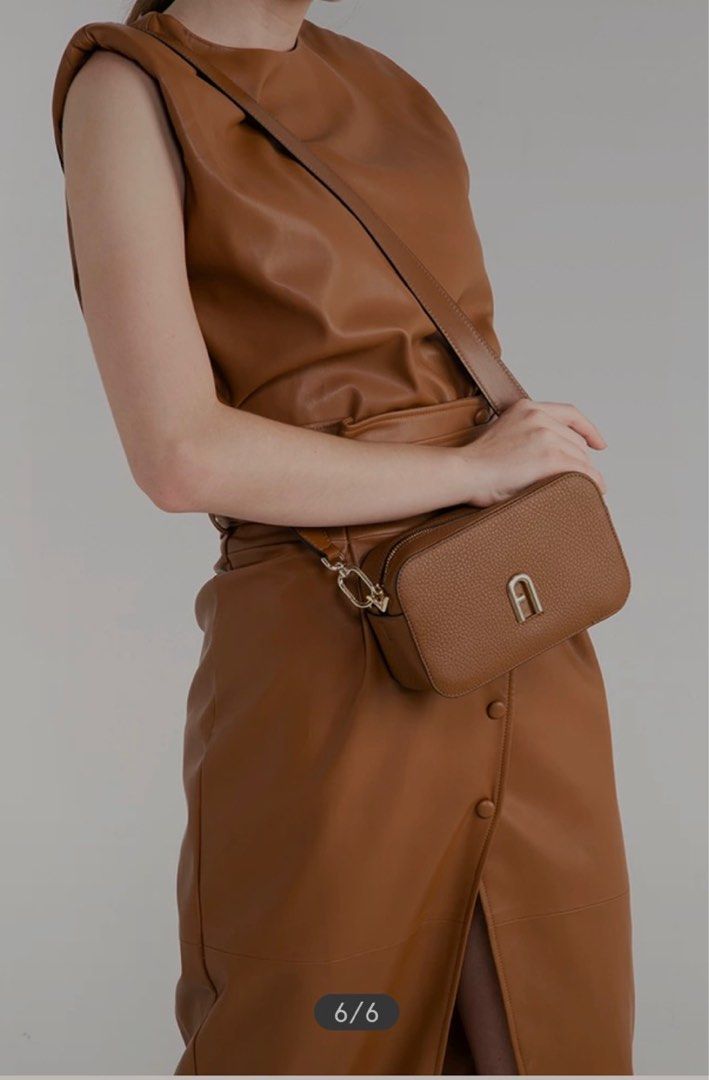 Furla Camera Bag (Category: Luxury Bags & Wallets) located in Manila. Submitted by noweenj (Listing ID 1344895724, Image 3). Description: Brand New Unused. FAS of the bag is the discolored logo at front as seen in pic. Hence the low price. .