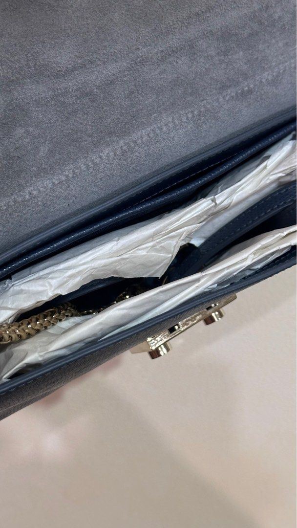 Furla Metropolis Shoulder Bag (Category: Luxury Bags & Wallets) located in Makati City. Submitted by alpacaborahae (Listing ID 1414317210, Image 2). Description: - Furla Metropolis shoulder bag - Color: Navy blue - Gold-tone clasp closure - Detachable shoulder strap - Multiple interior compartments - Includes chain strap and leather strap - Crossbody style.