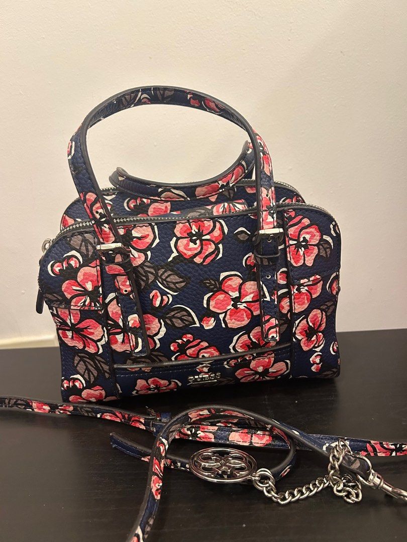 GUESS floral handbag authentic with detachable strap (Category: Shoulder Bags) located in Dasmarinas. Submitted by _beautifulthings_ (Listing ID 1414279987, Image 2). Description: 🌸 authentic 🌸 well-used 💐 needs cleaning 🌸 with detachable strap 🌸 many compartments.